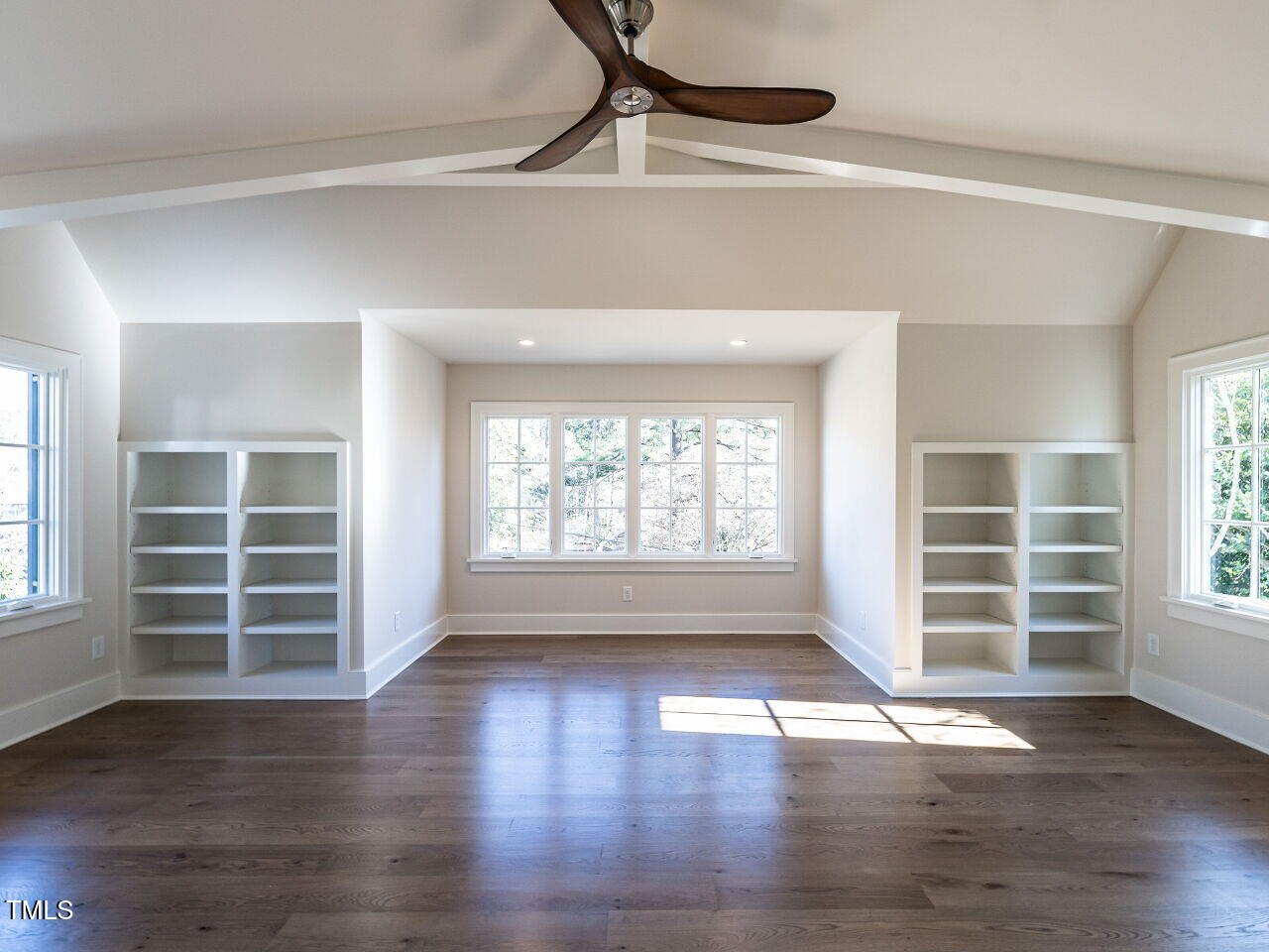 1307 Mayfair Road Raleigh, NC 27608 - Photo 43 of 59 an empty room with wooden floor and windows