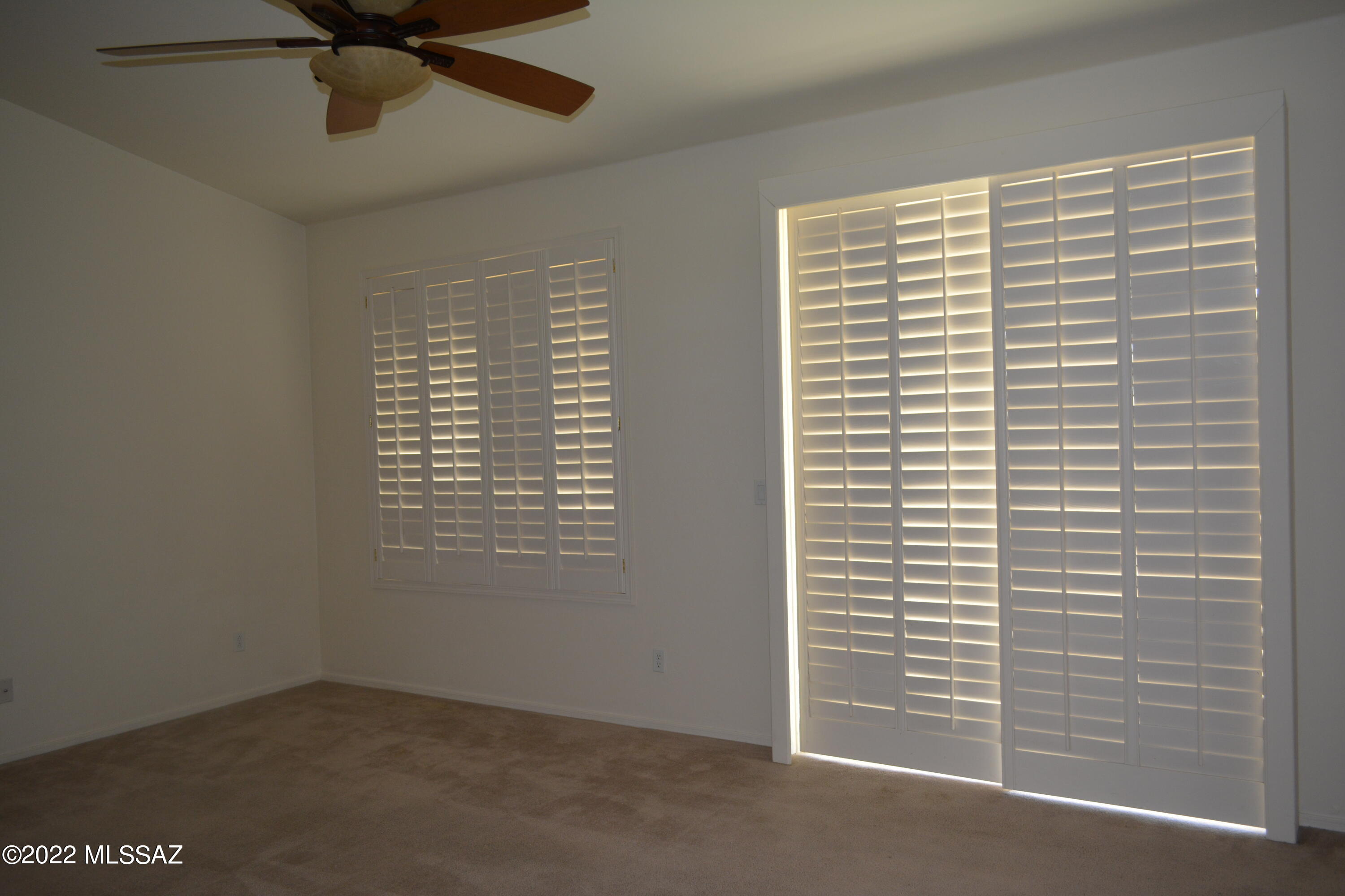 1714 Camino Rivera Rio Rico, AZ 85648 - Photo 7 of 26 a view of an empty room with a window