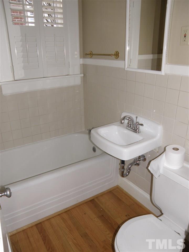 2625 Van Dyke Avenue Raleigh, NC 27607 - Photo 14 of 30 a bathroom with a sink toilet and a bathtub