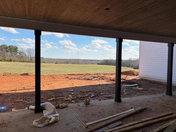 a view of a floor with a floor to ceiling window with wooden floor