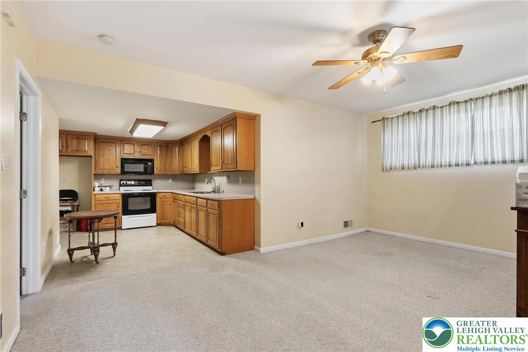 5217 Cider Press Road Schnecksville, PA 18078 - Photo 45 of 54 a view of kitchen with furniture and wooden floor