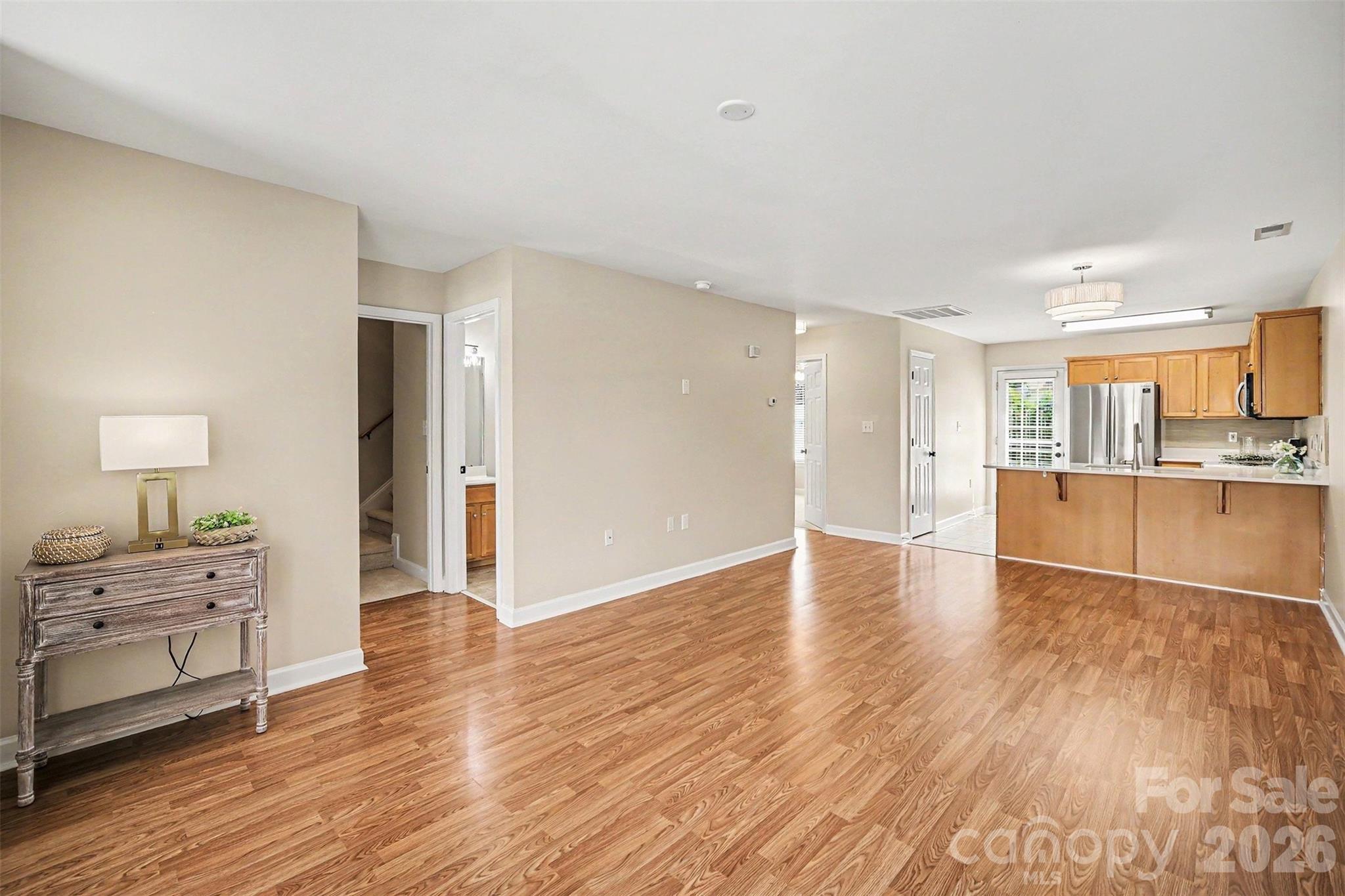 1210 Sheldon Brook Lane Fort Mill, SC 29707 - Photo 6 of 26 a view of a kitchen with wooden floor and a sink