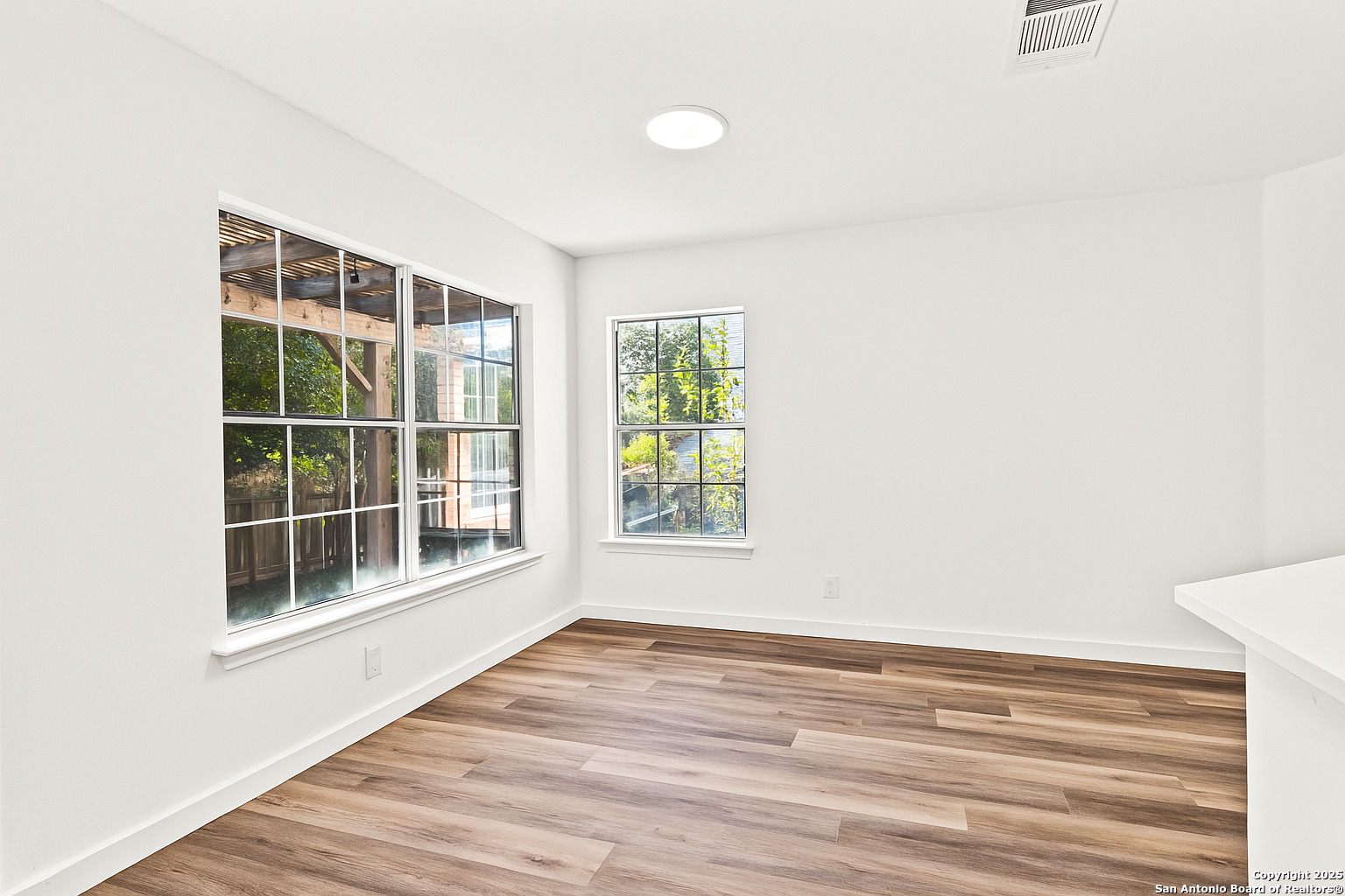 1687 Fir Circle Schertz, TX 78154 - Photo 11 of 25 a view of empty room with windows