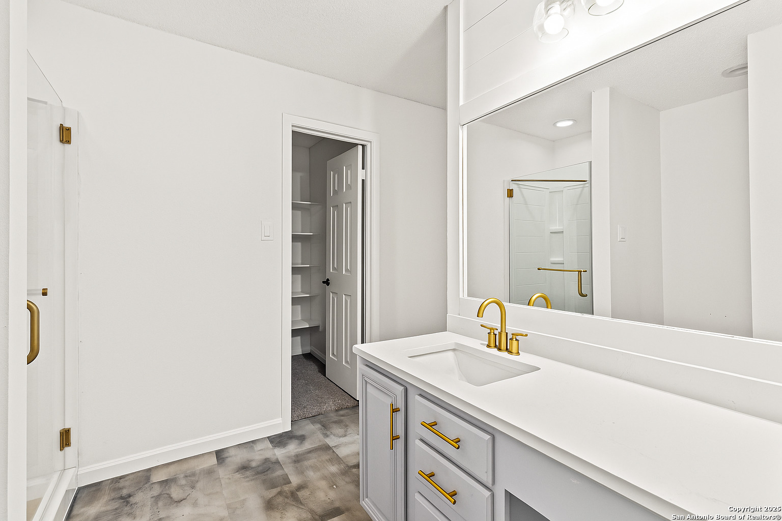 1687 Fir Circle Schertz, TX 78154 - Photo 17 of 25 a bathroom with a sink and a mirror