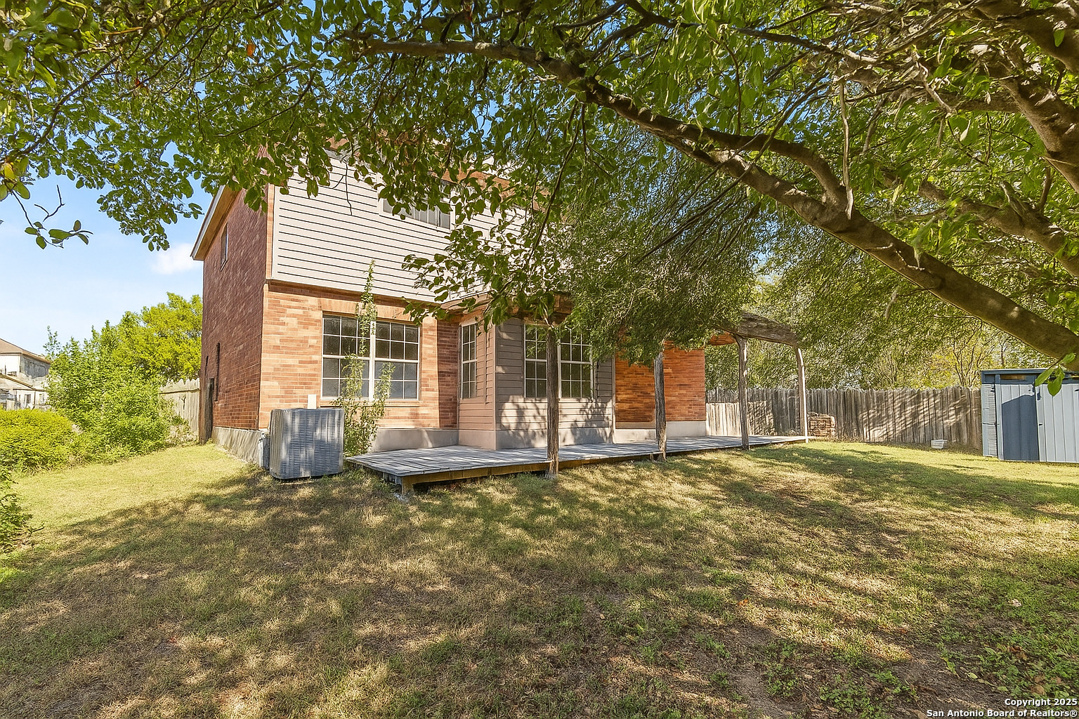 1687 Fir Circle Schertz, TX 78154 - Photo 25 of 25 a view of a house with a yard and sitting area