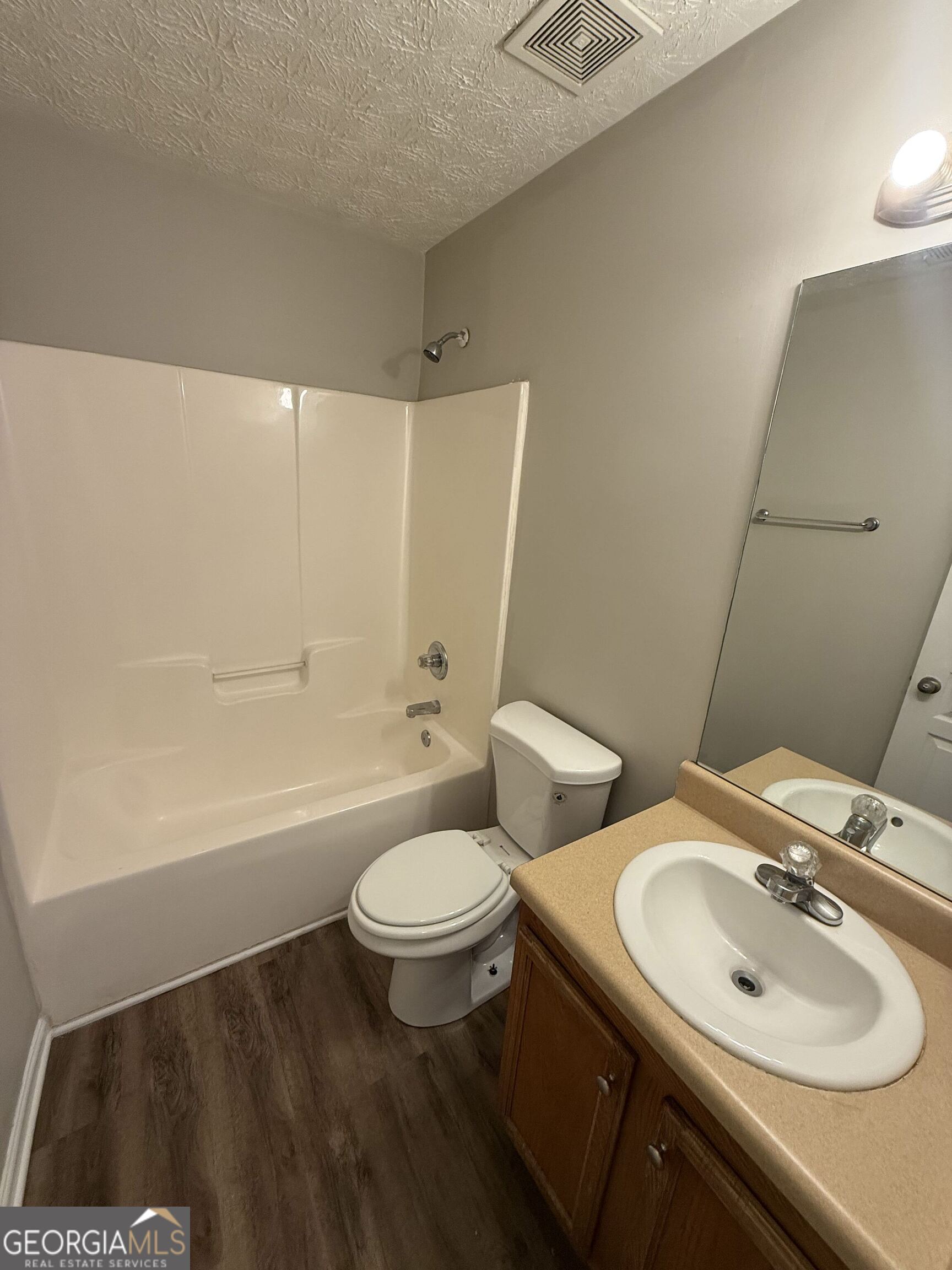 6132 Ruth Street Southwest Covington, GA 30014 - Photo 27 of 33 a bathroom with a sink and a mirror