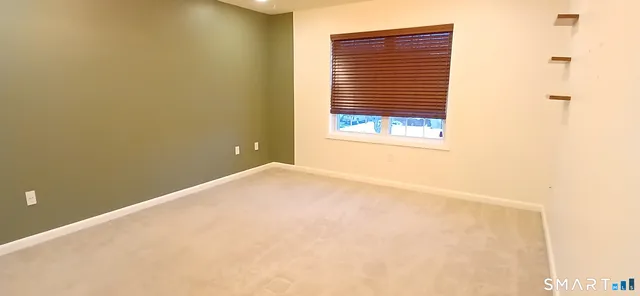 a view of a room that has a window in it
