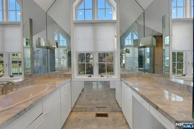 a large white building with a city view