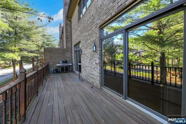 a view of a balcony with wooden floor