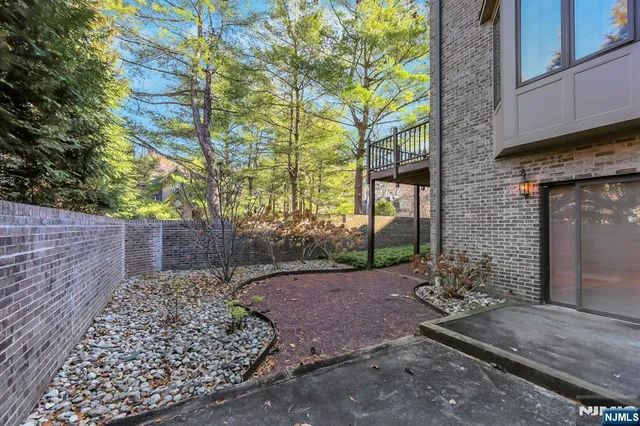 a view of a pathway both side of house