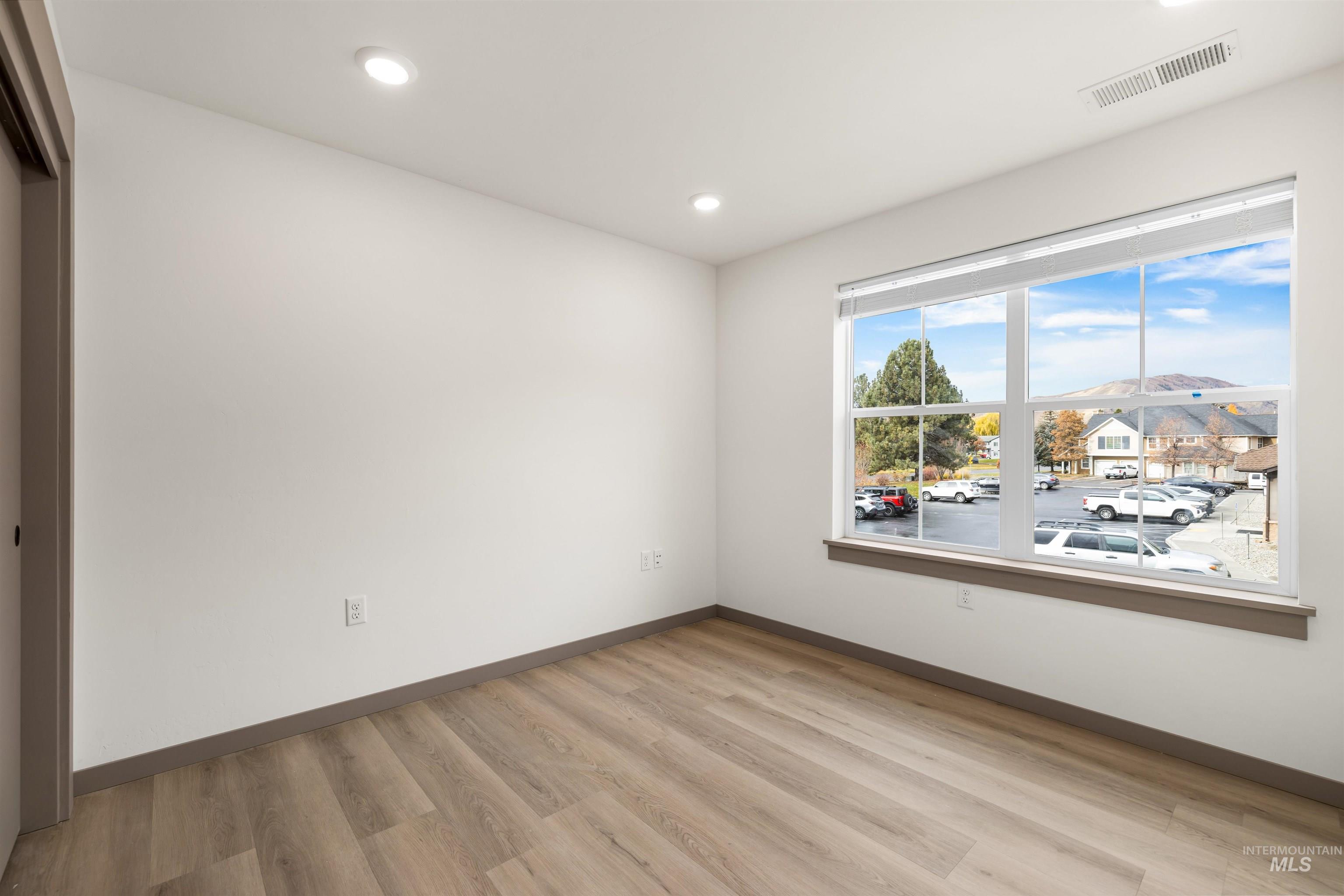 2010 Wimbledon Court Hailey, ID 83333 - Photo 15 of 46 Spare room featuring light wood-style flooring and recessed lighting