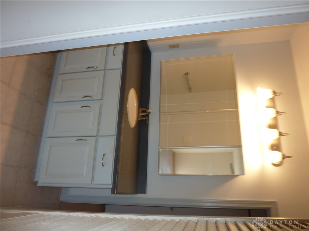 1345 Tattersall Road, Unit 64 Dayton, OH 45459 - Photo 14 of 25 This bathroom features a sleek vanity and functional mirror with integrated lighting.
