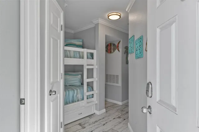 a bathroom with a glass shower door and a window