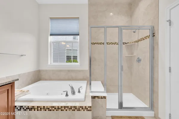 a bath tub sitting next to a window