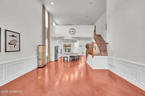 a view of an entryway with wooden floor