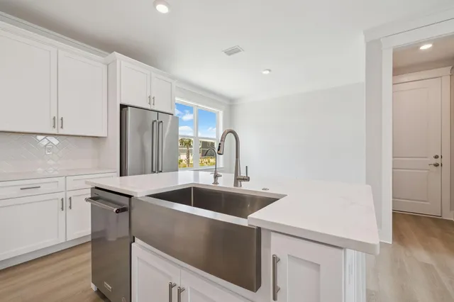 a view of an empty room with white walls