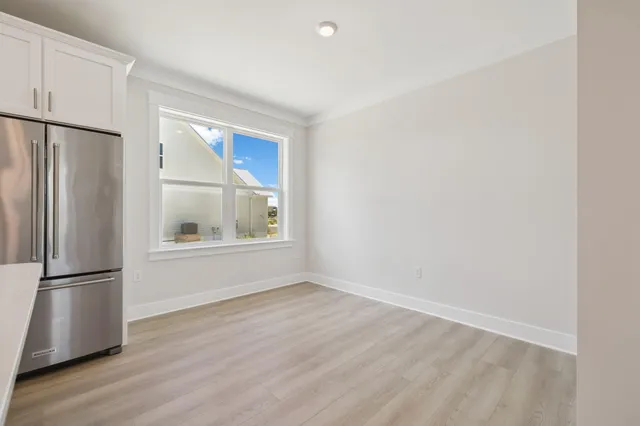 a bathroom with a double vanity sink toilet and a mirror