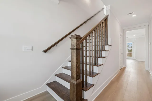 a bathroom with double vanity sinks and a mirror