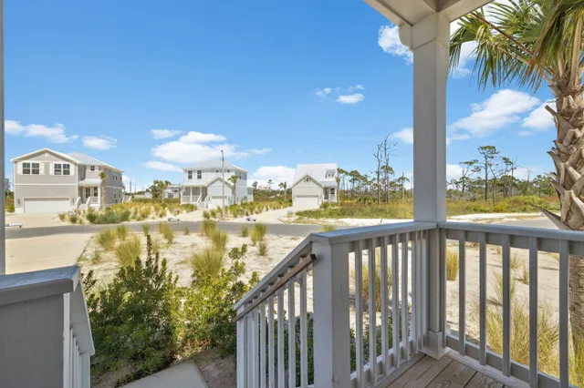 a view of a kitchen with a sink and an empty room