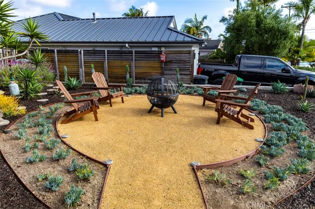 swimming pool view with a seating space