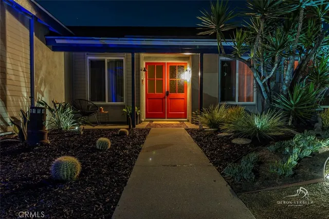 a view of house with patio outdoor seating