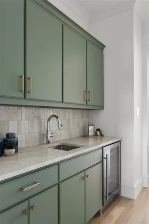 a kitchen with a sink and cabinets