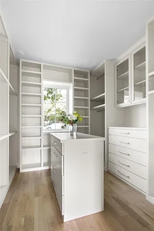 a kitchen with a stove a sink and a window