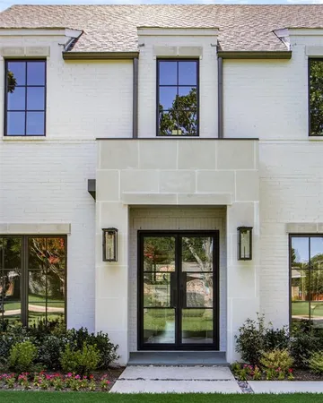 a front view of a house with garden