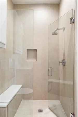 a bathroom with a bathtub and shower