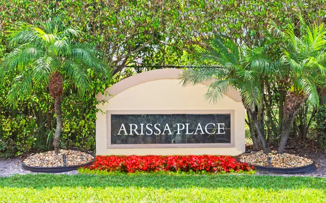 a sign that is sitting in front of flowers