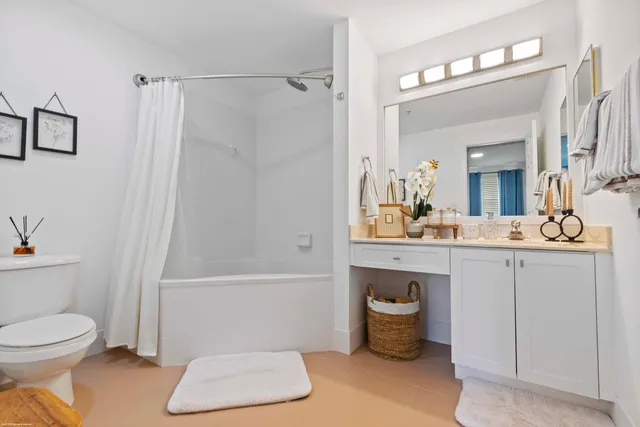 a bathroom with a toilet a sink and bathtub