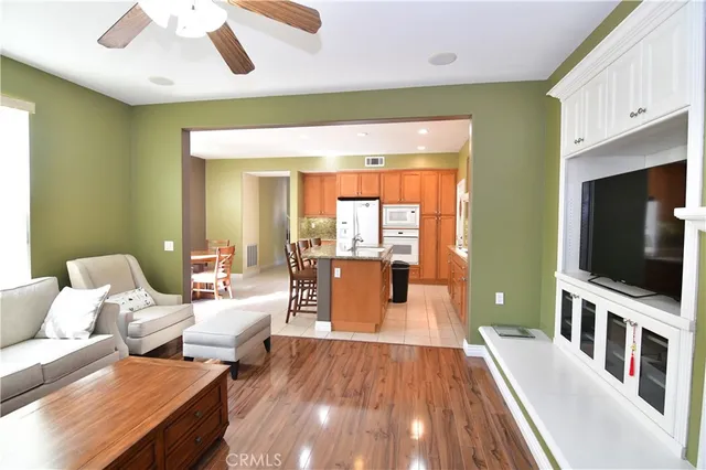 a living room with couches and a flat screen tv