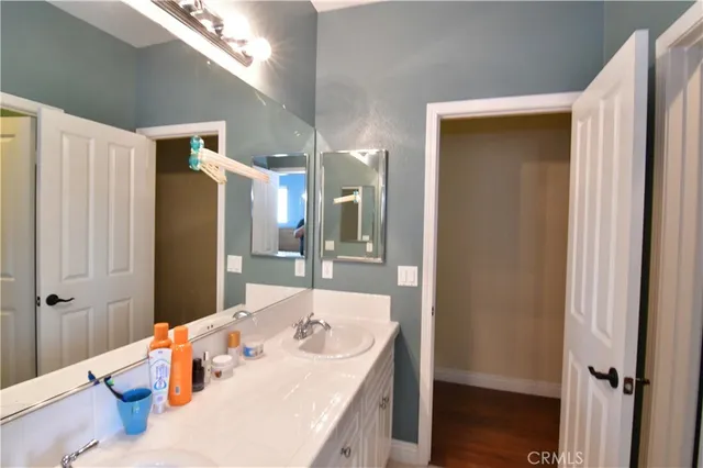 a bathroom with a sink double vanity and shower