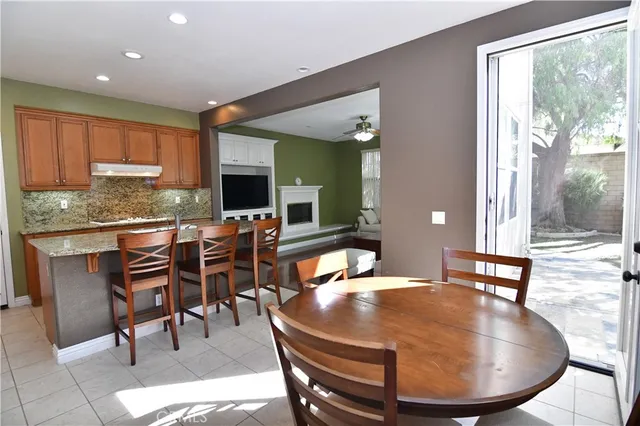 a room with dining table and wooden floor