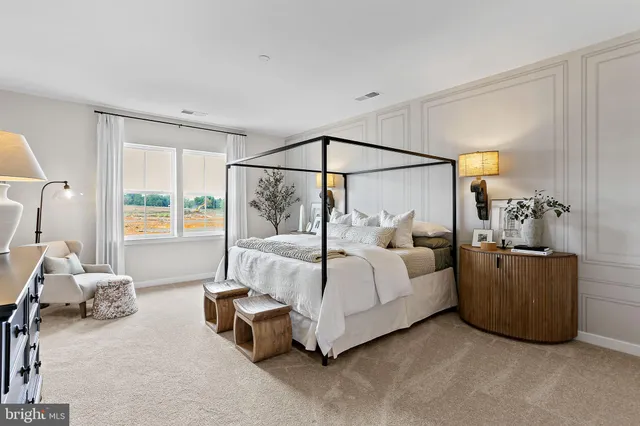 a bedroom with bed and a window