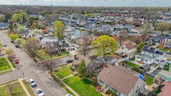 an aerial view of residential houses with outdoor space
