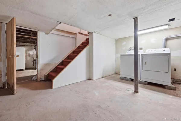 a view of a hallway with staircase