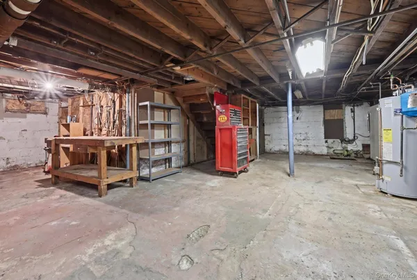 a view of a room with wooden ceiling