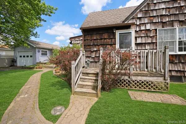 a view of a house with wooden fence