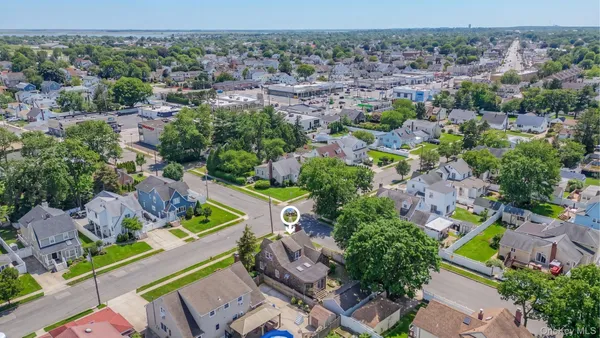 an aerial view of multiple house with outdoor space