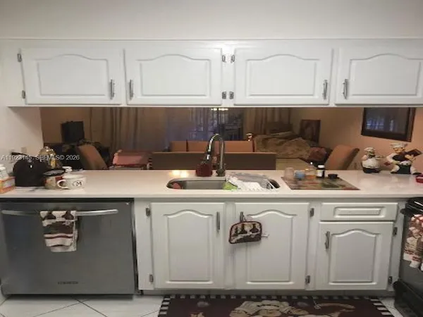 a kitchen with a sink and cabinets