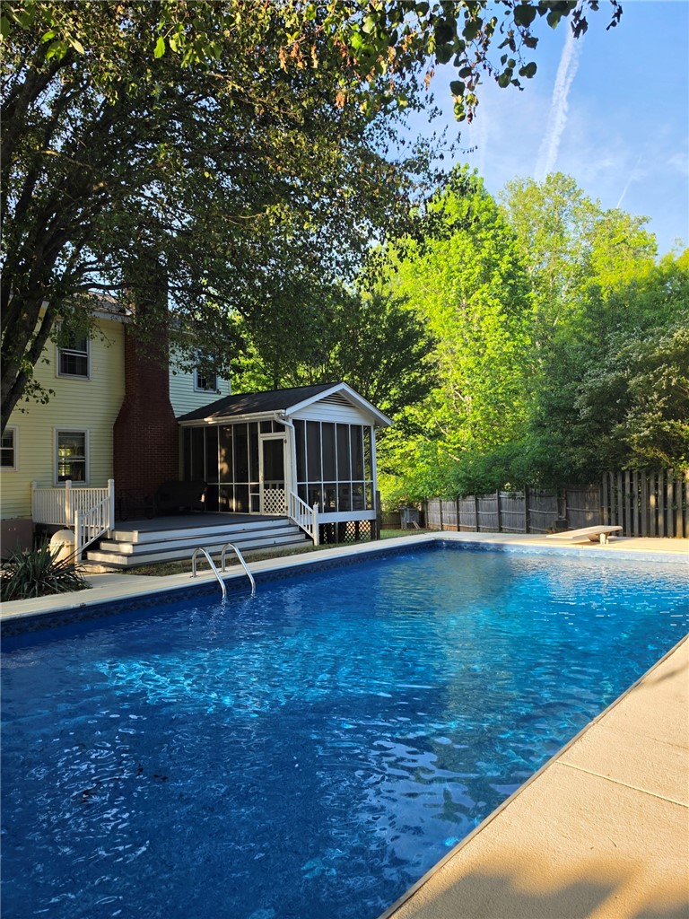 224 Regency Circle Anderson, SC 29625 - Photo 37 of 43 An inviting backyard oasis offers a sparkling pool and a charming screened porch.