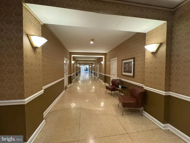 a lobby with furniture and a table