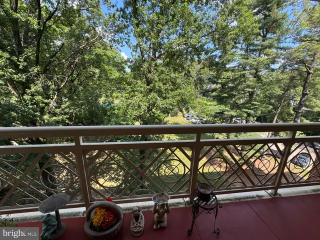 a view of a roof deck with wooden fence