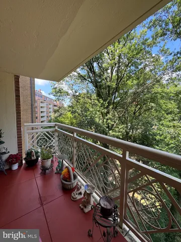 a view of a balcony with chairs