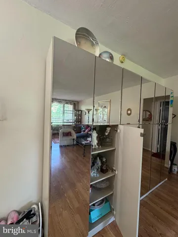 a view of room with furniture and wooden floor