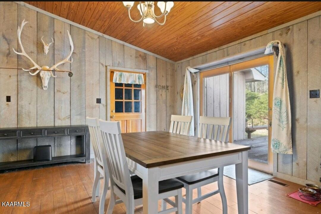 2122 Northwest Old River Road Charleston, TN 37310 - Photo 16 of 28 a view of a dining room with furniture and wooden floor