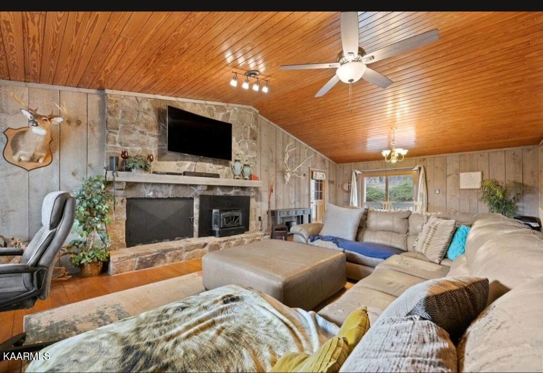 2122 Northwest Old River Road Charleston, TN 37310 - Photo 3 of 28 a living room with furniture a flat screen tv and a fireplace