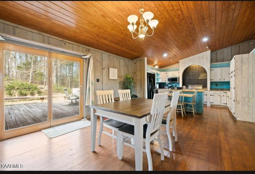 2122 Northwest Old River Road Charleston, TN 37310 - Photo 4 of 28 a dining table tennis chairs and a table