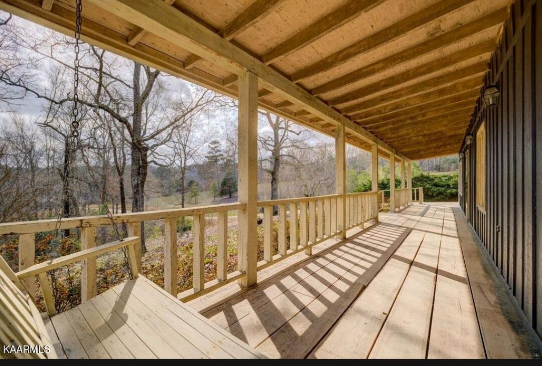 2122 Northwest Old River Road Charleston, TN 37310 - Photo 5 of 28 a view of balcony with wooden floor and fence with the couches